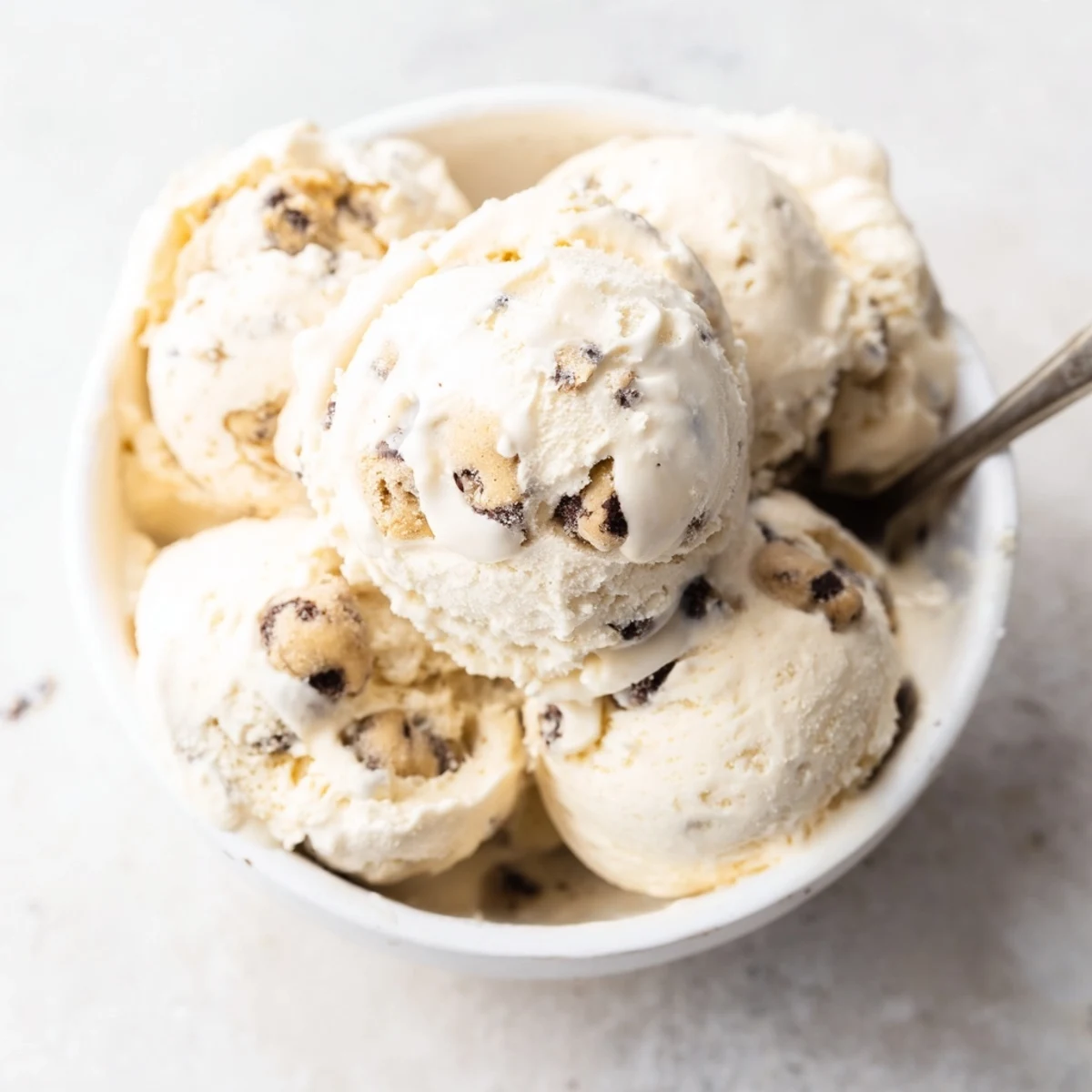 Creamy Cottage Cheese Ice Cream with Cookie Dough, topped with mini chocolate chips.  