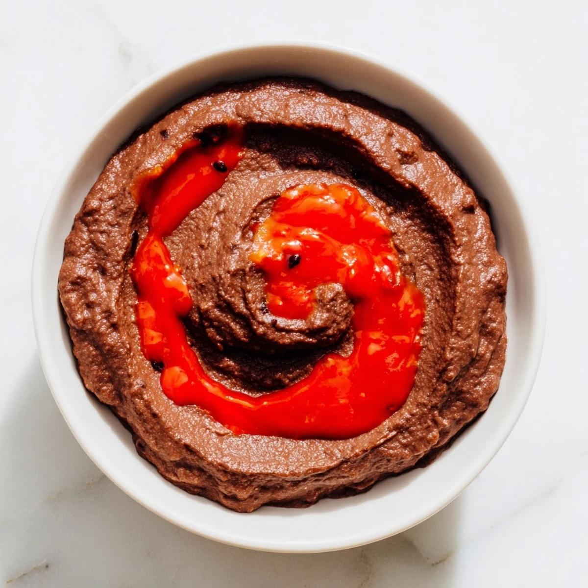 This easy Spicy Black Bean Dip recipe features a smooth texture and a delightful spicy kick for snacking.