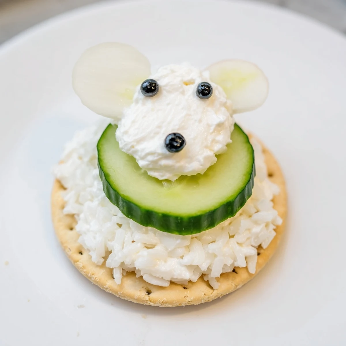 Creamy, chilled Polar Bear Iceberg Cracker Stacks featuring olive noses and radish ears, ready to eat.