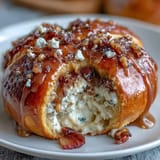 Hot cross buns with citrus glaze, soft and spiced, topped with a zesty orange-lemon drizzle.  