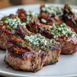 2. Savory lamb chops seasoned with garlic and rosemary, served with bright mint gremolata.  