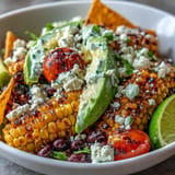 Hearty black bean taco salad with smoky grilled corn, vibrant vegetables, ready for lunch.