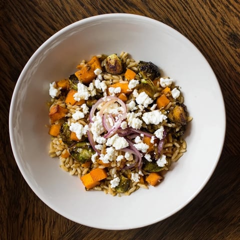 A beautiful bowl of Best Fall Harvest Orzo Salad with roasted veggies and creamy goat cheese.