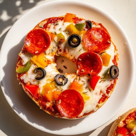 Golden, bubbly mini bagel pizzas, a quick air fryer snack bursting with cheesy goodness.