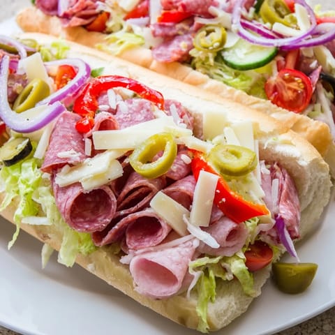 Sliced Italian meats and cheeses create delicious Flavor Mash-Up Sandwiches full of zest.  