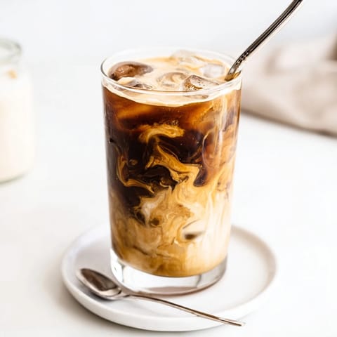 Rich and nutty Tahini Iced Coffee served in tall glasses, ideal for refreshing breaks.  