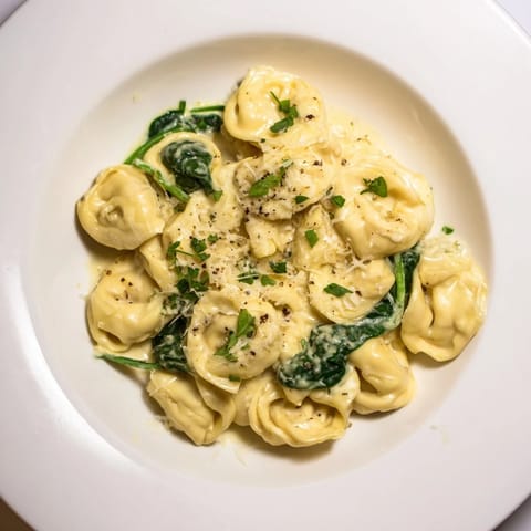 Delicious Creamy Spinach Alfredo Tortellini, a restaurant-quality meal with rich Alfredo and tender pasta.