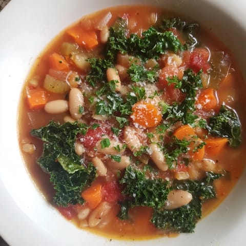 A satisfying bowl of Italian Bean & Kale Stew: a vegetarian delight with beans and tender kale.