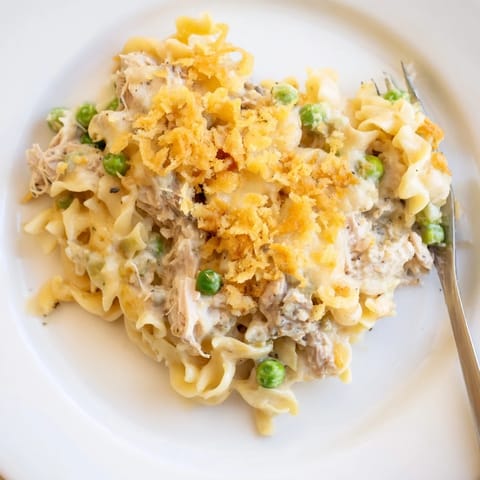 Steaming hot Creamy Tuna Noodle Casserole, a family-friendly dish bursting with creamy flavors.