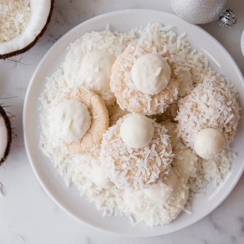 Festive Snowflake Dessert Board, a stunning array of cookies, chocolates and fruits arranged beautifully.
