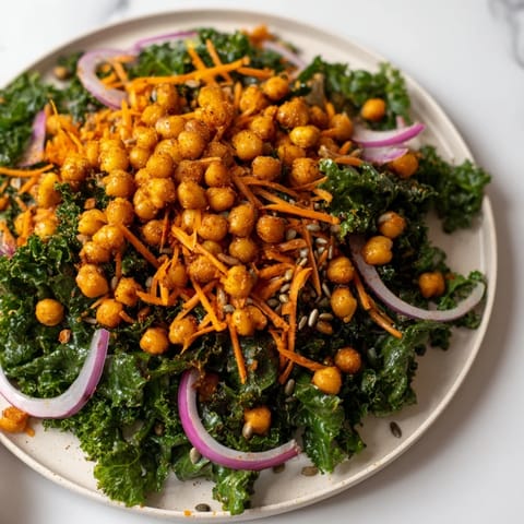 Close-up of a vibrant Kale Salad with Roasted Chickpeas, with crunchy texture and bright colors.