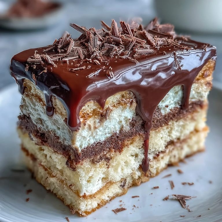 A slice of Hojicha Butter Cream Cake reveals soft sponge and creamy frosting