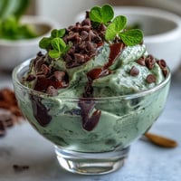 Creamy mint chocolate chip dip with shamrock sprinkles, perfect for festive St. Patrick's Day dessert spreads.